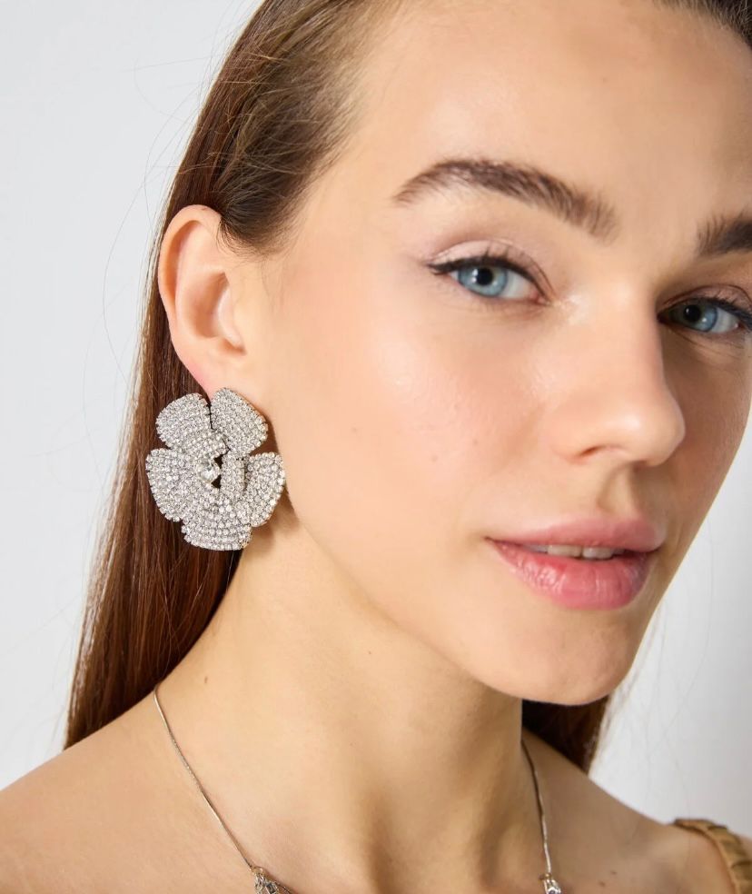 Silver color tone flower shaped earrings with crystal stones