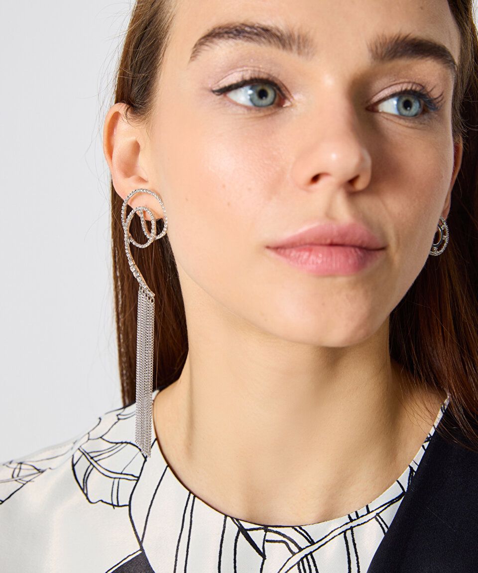 Silver color earrings with a chain, abstract design